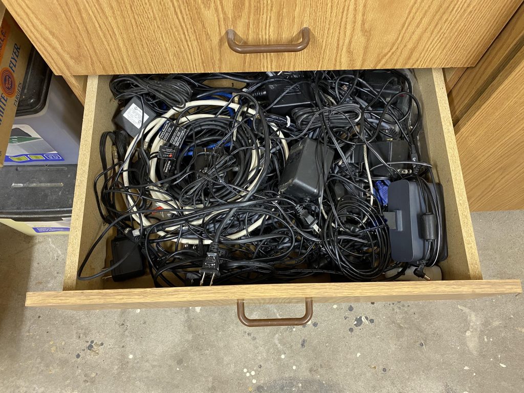 a desk drawer full of old, somewhat-tangled cables 
