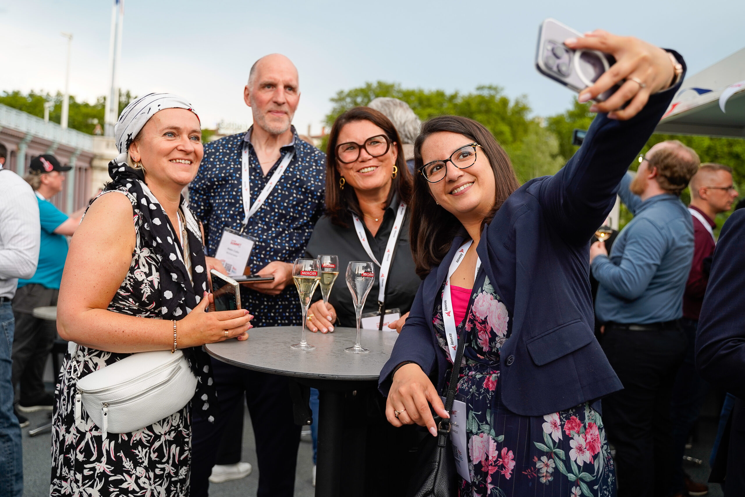 Attendees take a group selfie on board a boat at Axway Summit 2024 in Lyon, France