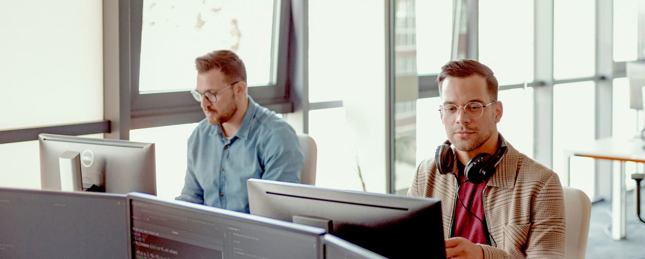 Software engineer working with user interface on computer screen to develop new security firewall and html script. Database programmer writing code with server algorithms on terminal window