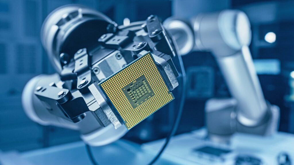 A robot arm holding a CPU microchip