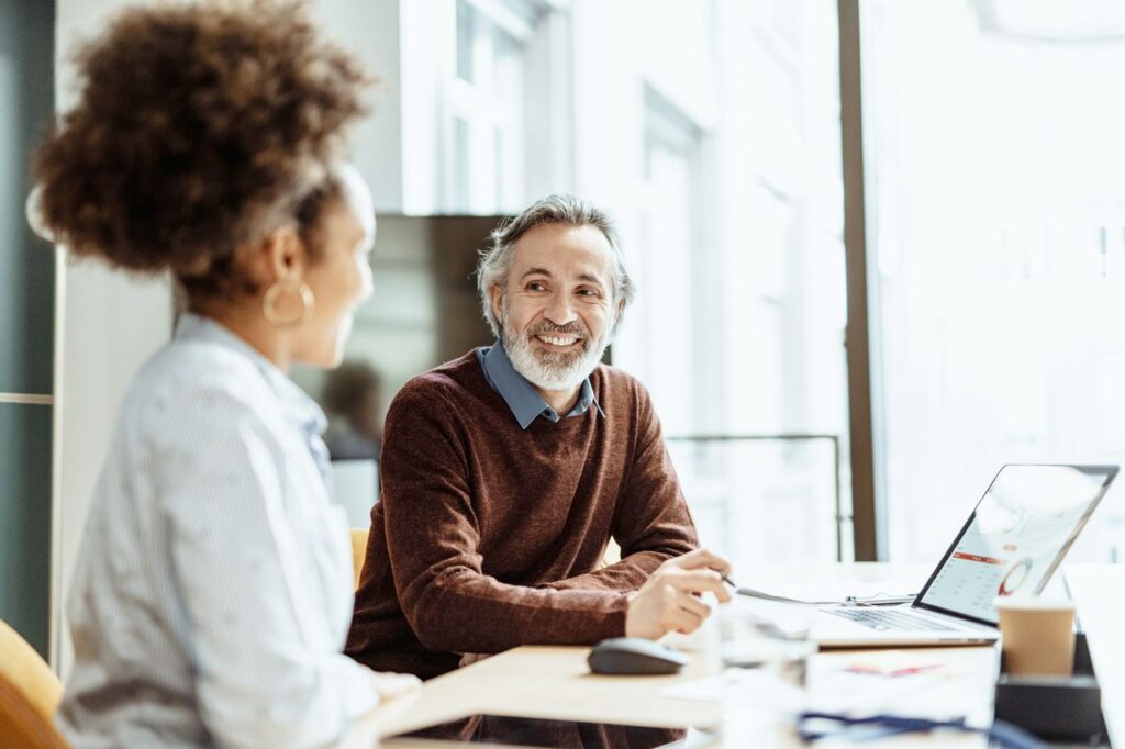Business people dressed in smart casual clothing working in office