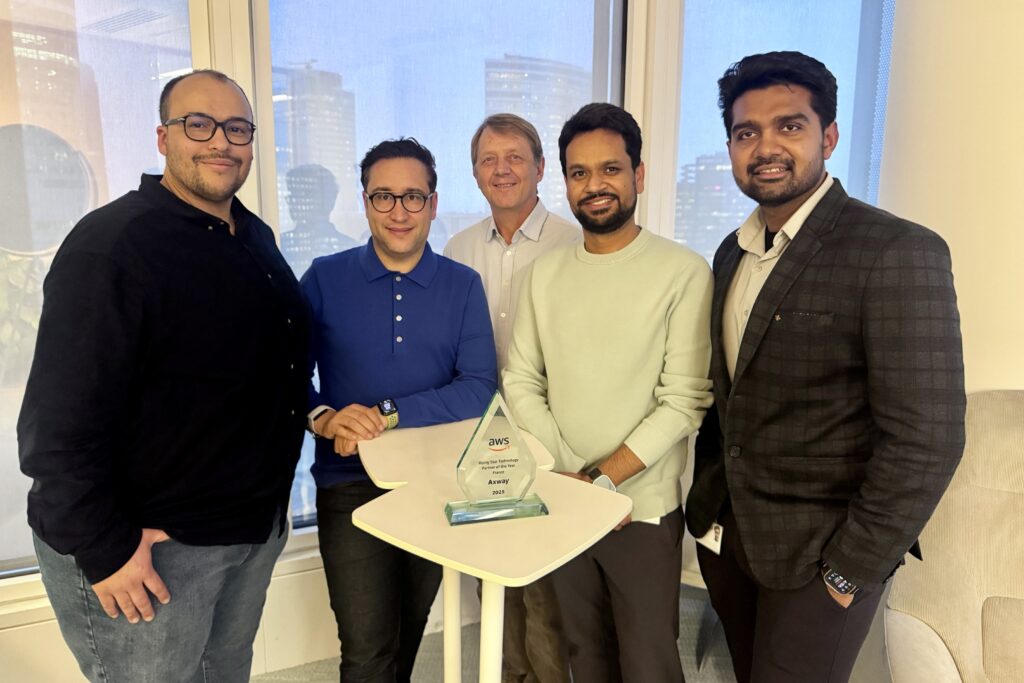 Pierre Baudin Bassem KTITA Yves Lajouanie Anuj Agarwal, Vikas Goel, and Ahmed Belkhir are pictured in the Paris Axway office with the 2025 EMEA AWS Regional Partner Award