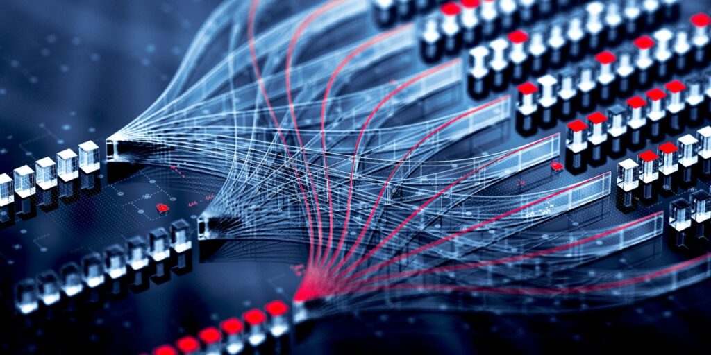 Close-up of a printed circuit board with rows of microcomponents and illuminated red nodes, intersected by fine translucent lines resembling data connections.
