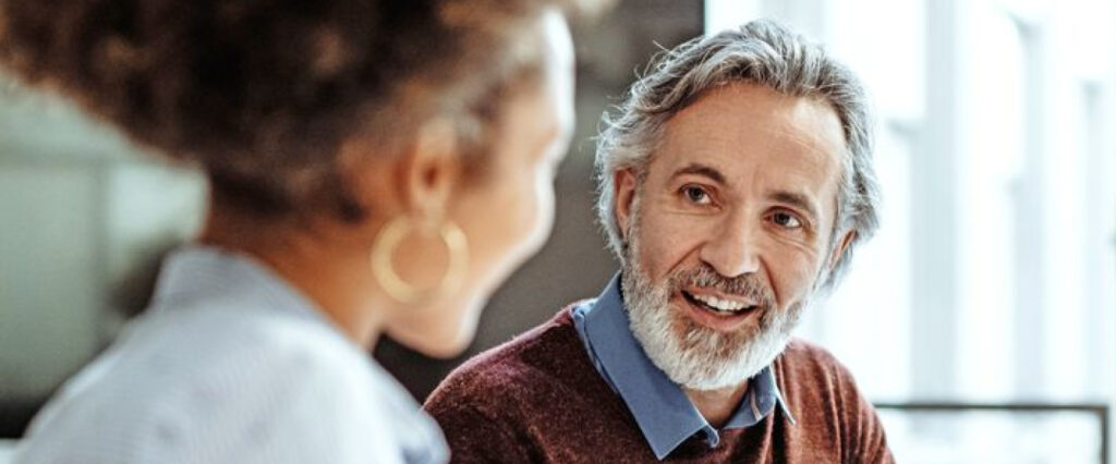 A man and a woman discussing ideas at the office